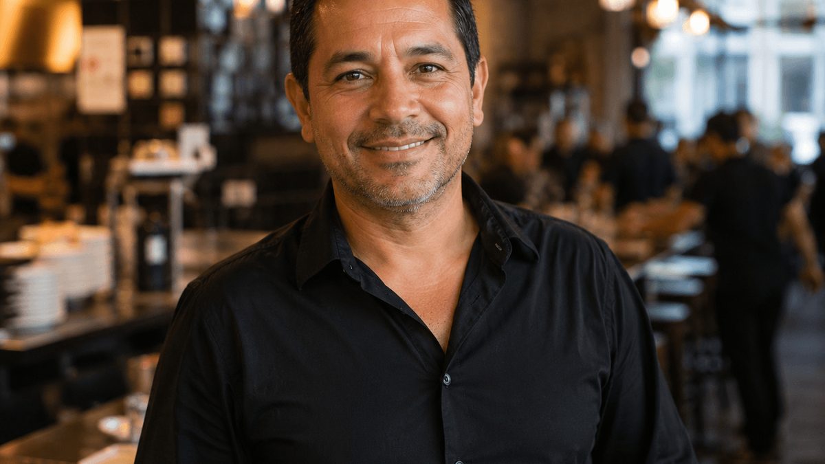 Restaurant owner reviewing merchant cash advance statements in their restaurant